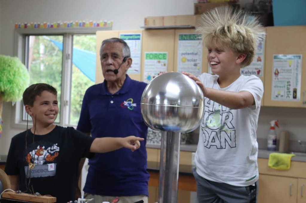 A Van de Graaff generator demonstration — interactive wonder, professionally operated